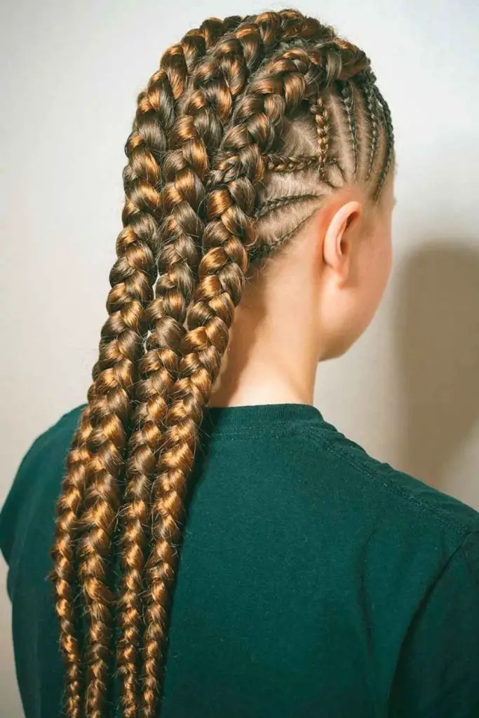 Bold twists styled into a high mohawk.