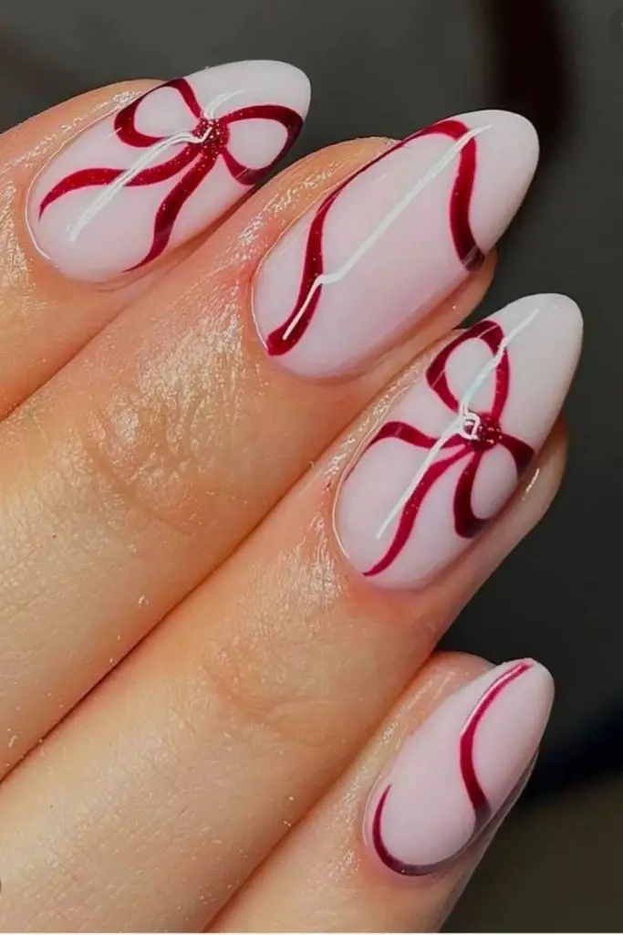 Velvet-effect nails in deep Valentine hues.