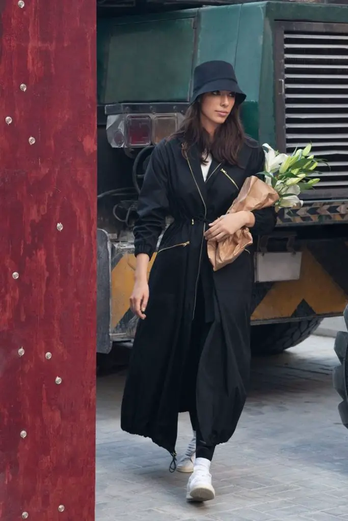 Dramatic puffed sleeves make a bold statement.