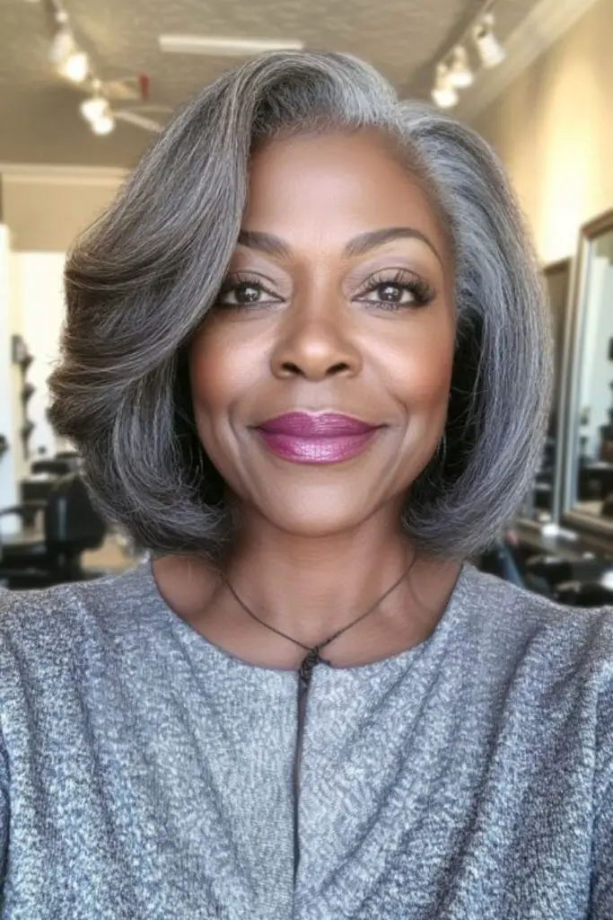 Voluminous gray bob cut with added fullness.