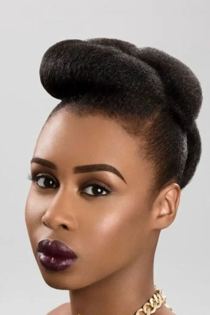 High-volume wool pompadour for bold style.