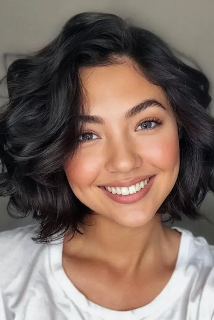 Straight blunt bob with curled ends.