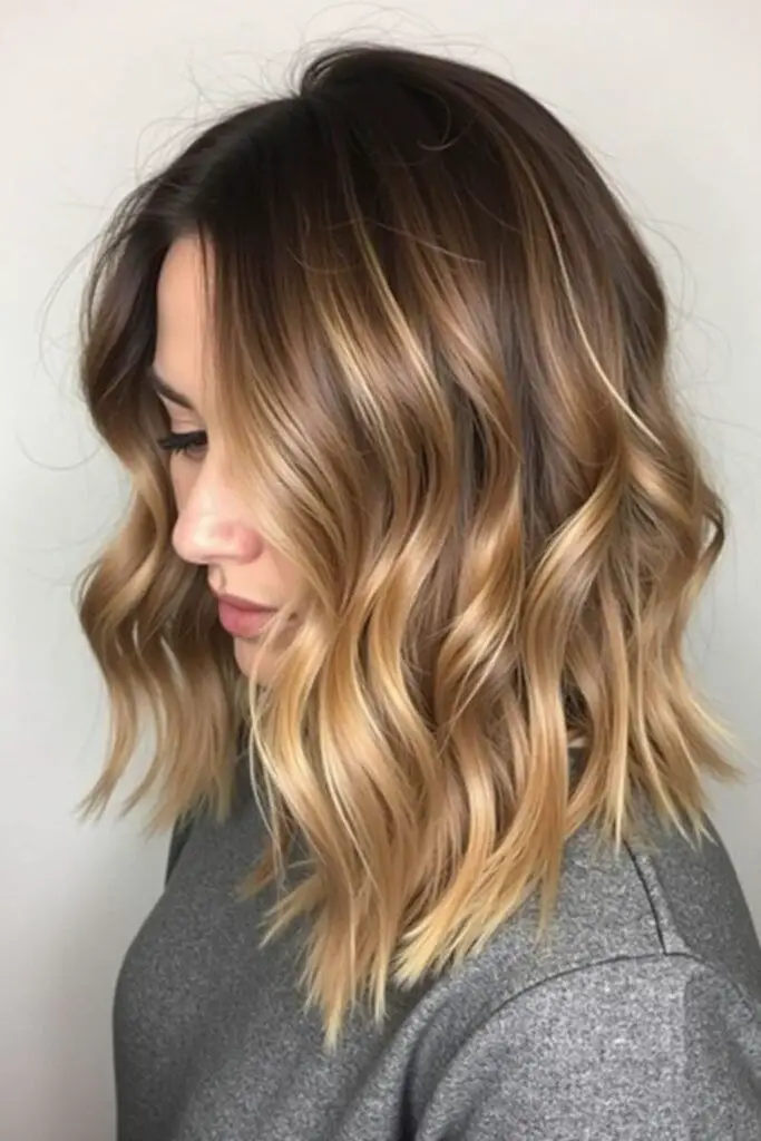 Warm butterscotch balayage with blended tones.
