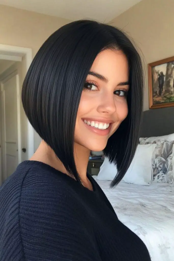 Dark sleek bob with precise cut.