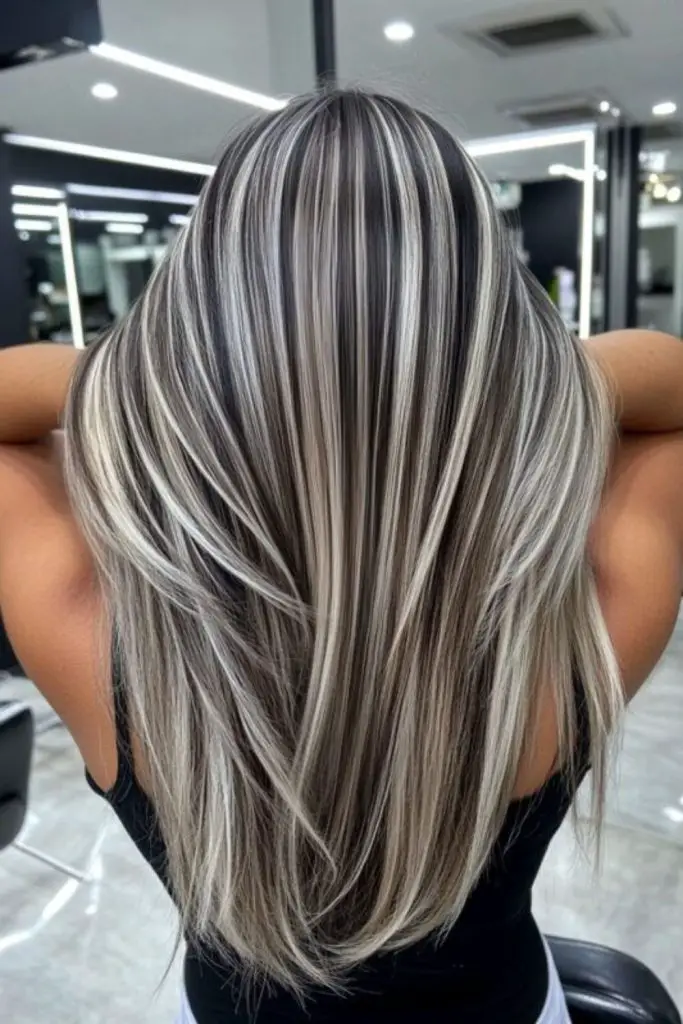 Icy platinum babylights on gray strands.