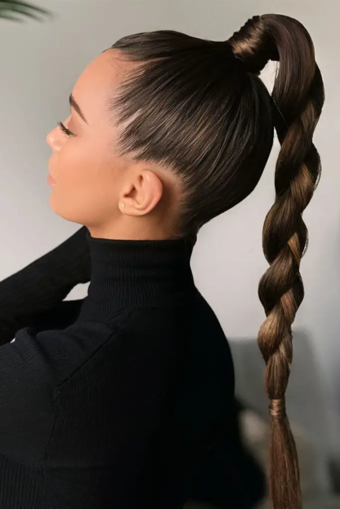 Slick scalp braids merging into ponytail.