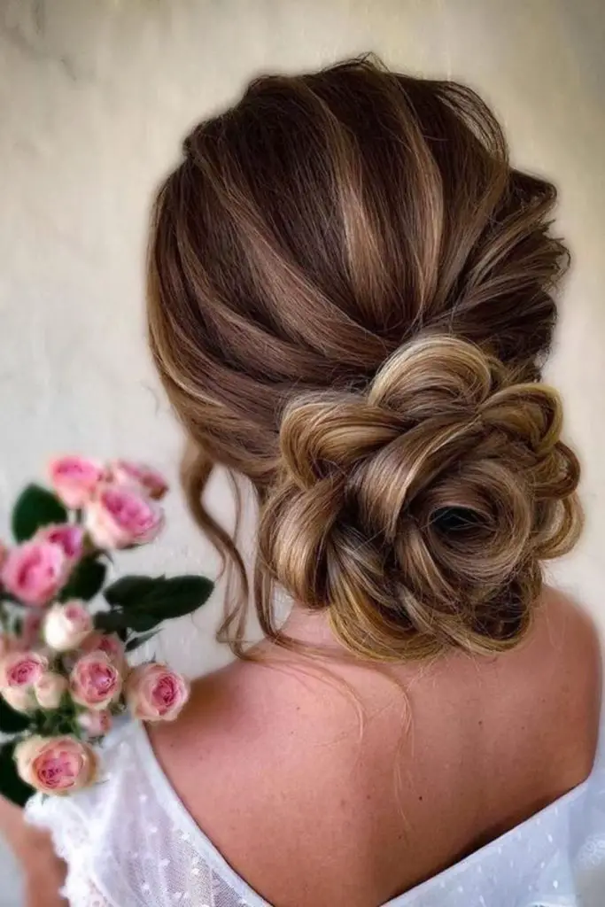 Sculpted rose-inspired twisted updo.