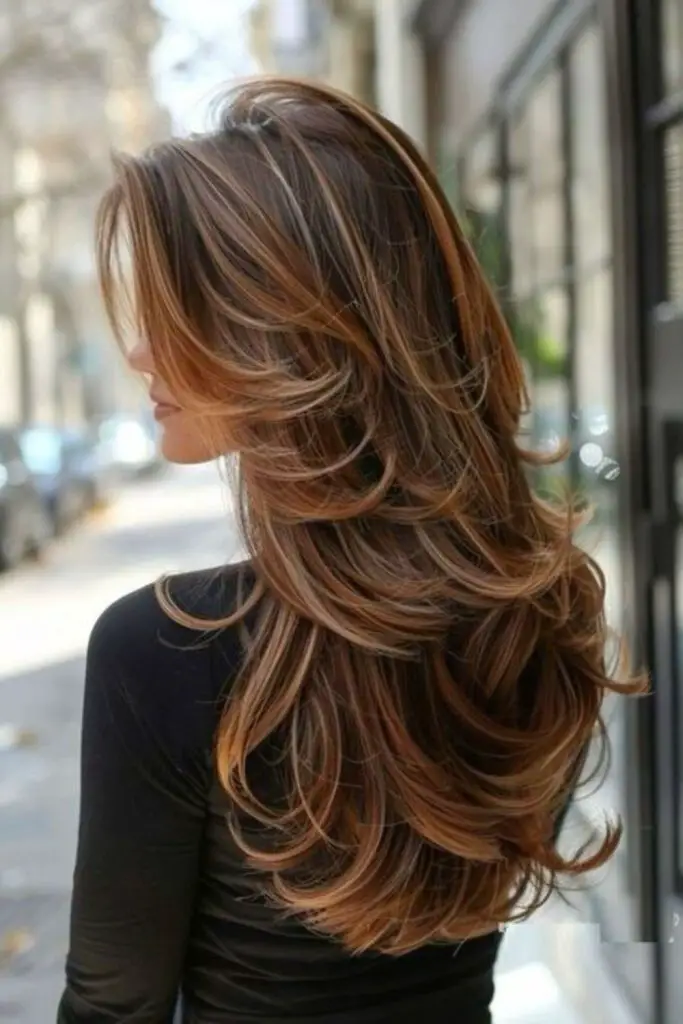 Waterfall-style layered butterfly haircut.