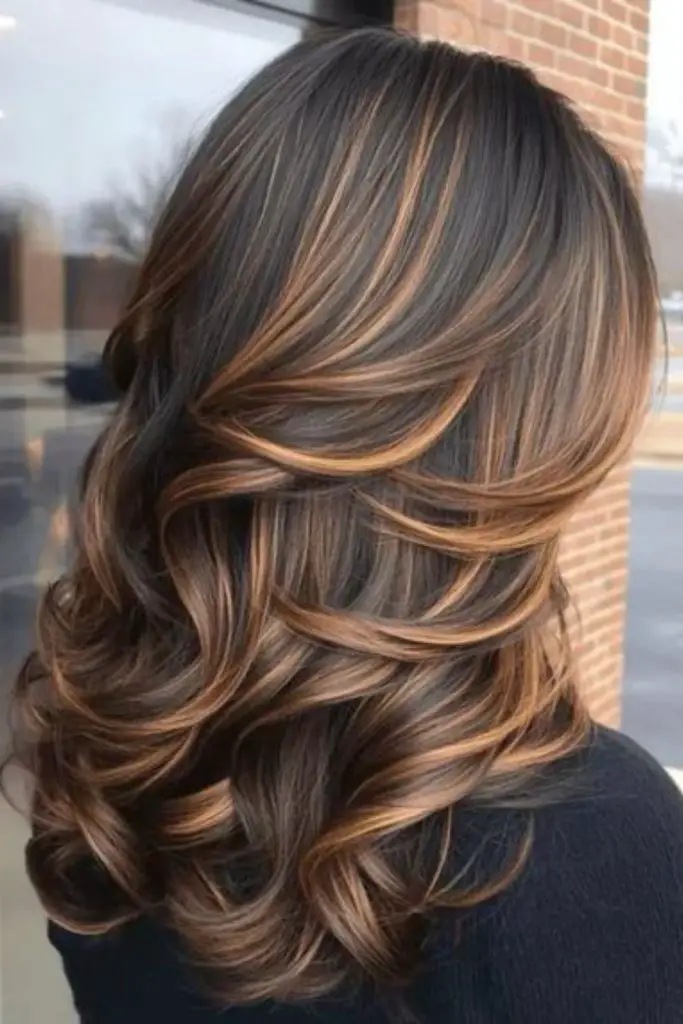 Cinnamon bronze balayage in flowing hair