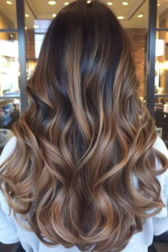 Dusty toffee balayage on brunette curls