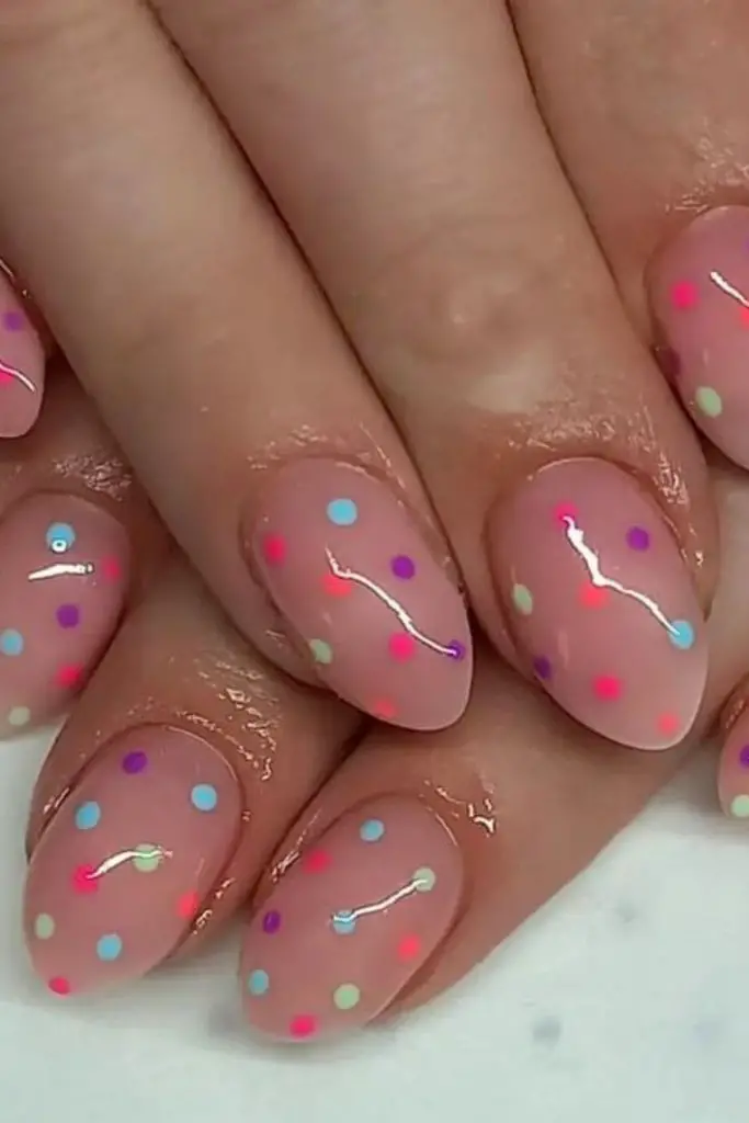 Pink sheer nails with tiny dots.