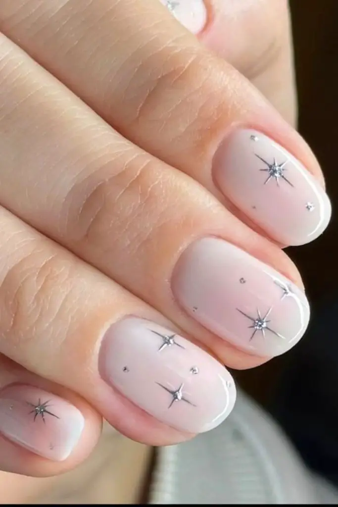 Milky white nails with star sparkle