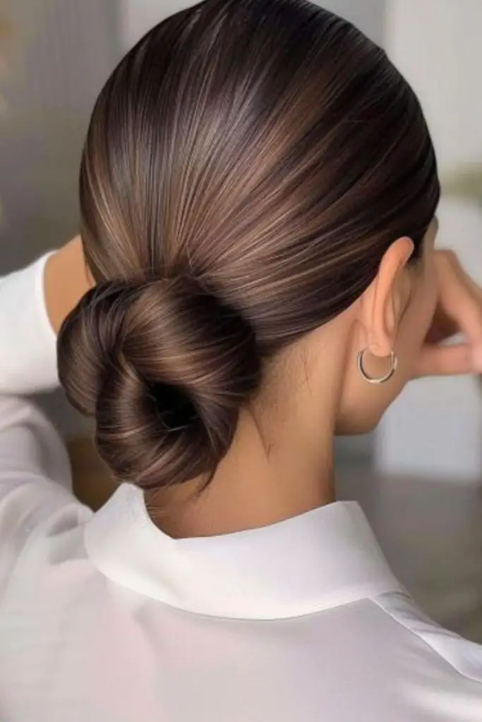 Loose bun with teased root volume.