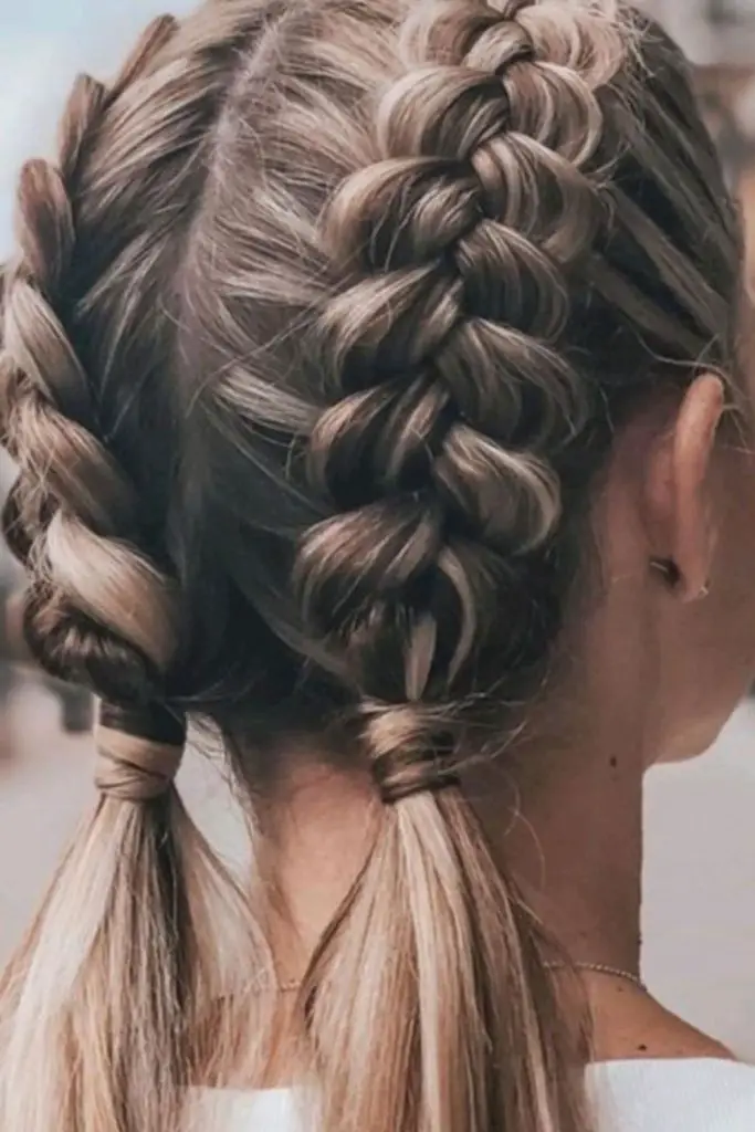 Twisted short ponytails with bold grip.