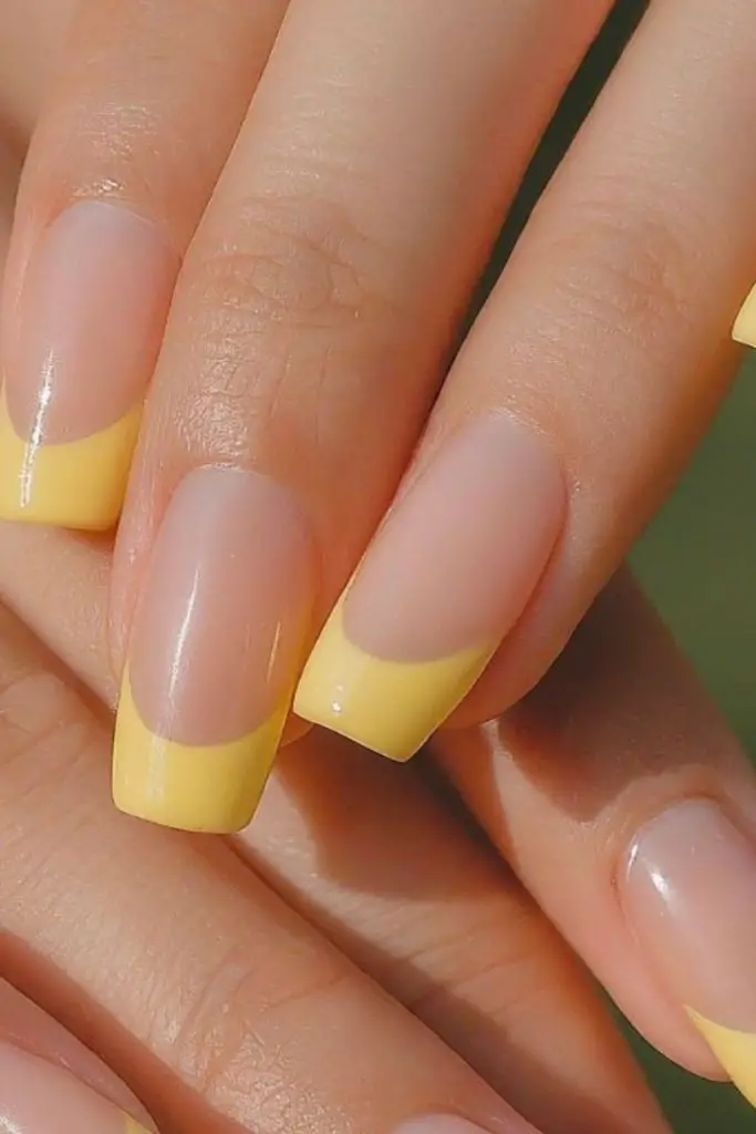French tips with banana yellow polish.