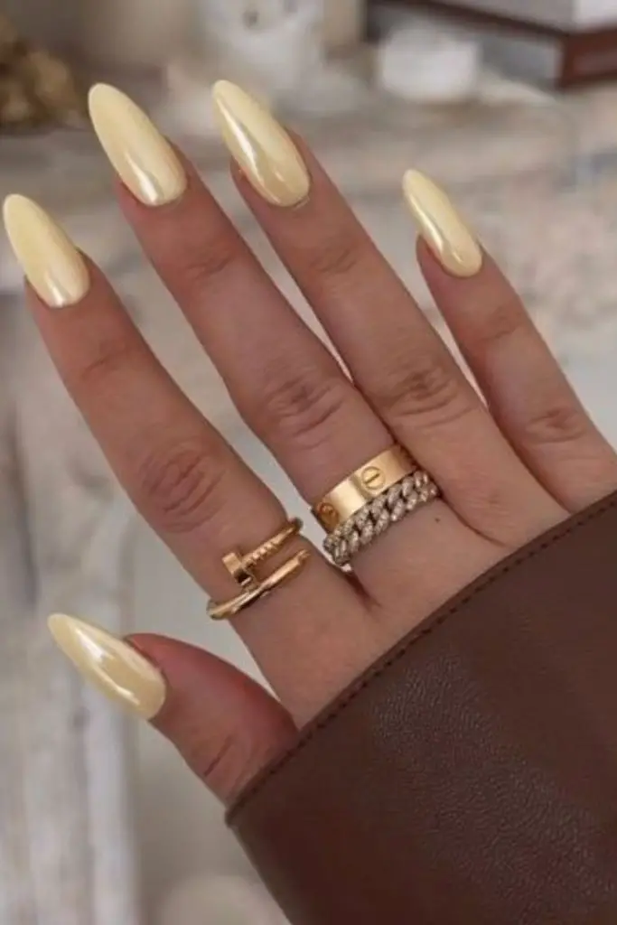 Chrome pastel nails in sunny yellow.