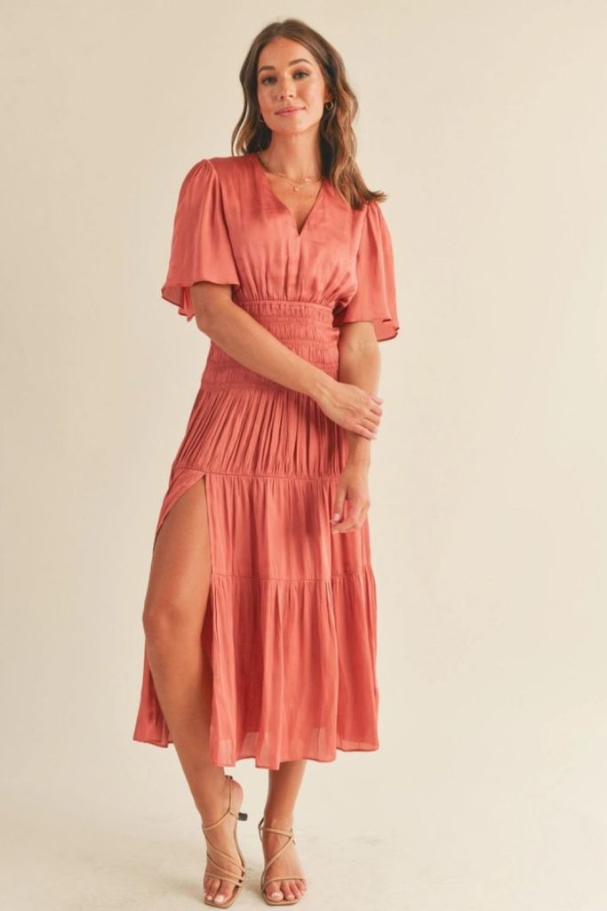 "Coral maxi dress with ankle-length flow."