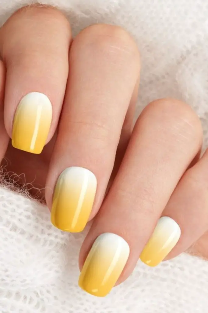 Yellow cuticle ombré with nude tops.
