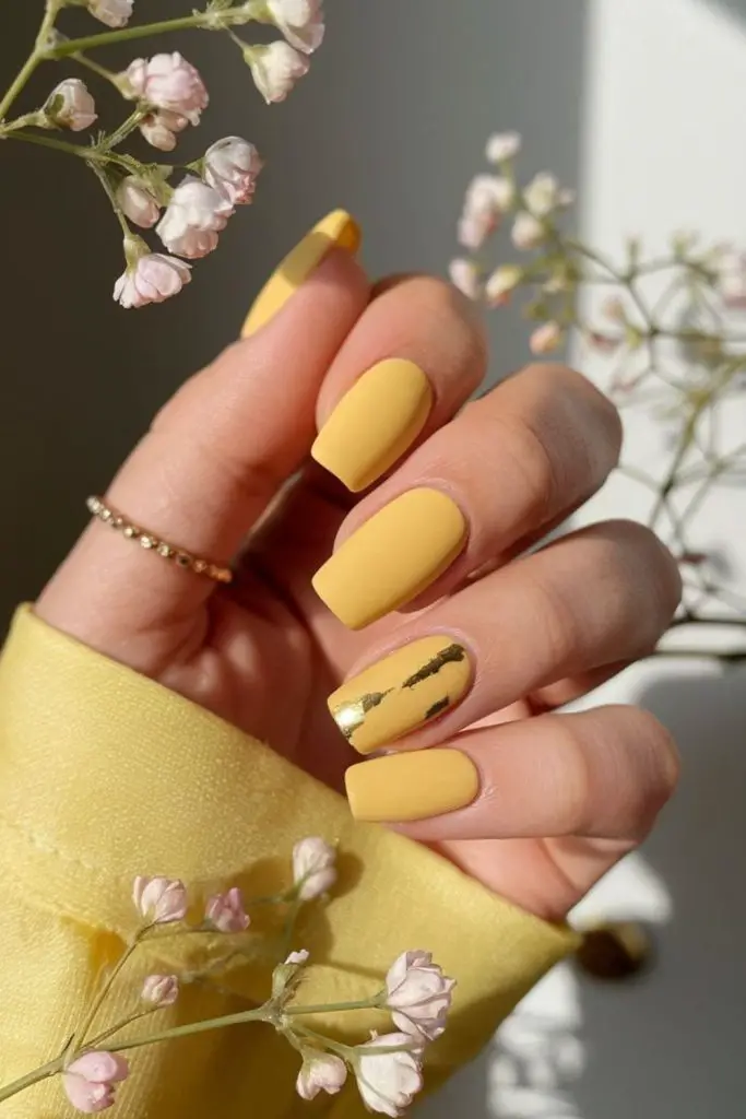 Matte dandelion yellow minimalist nails.