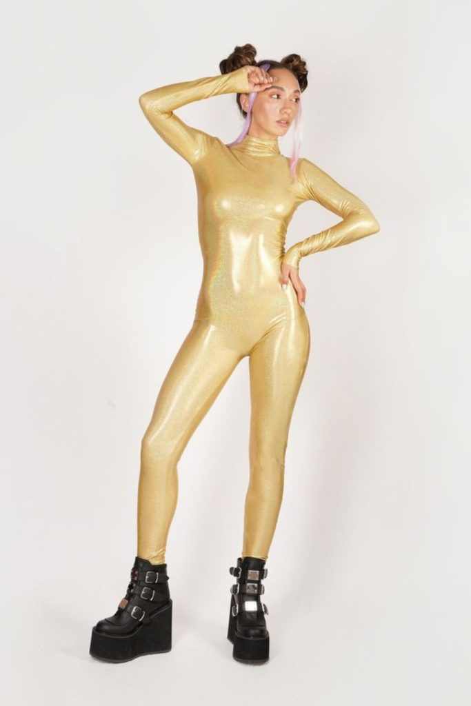 Iridescent catsuit with plastic trench.