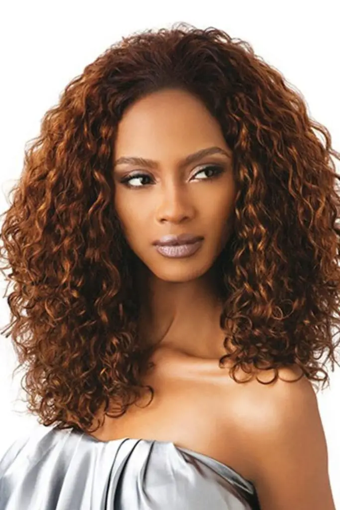 Warm honey curls flipped in waves.