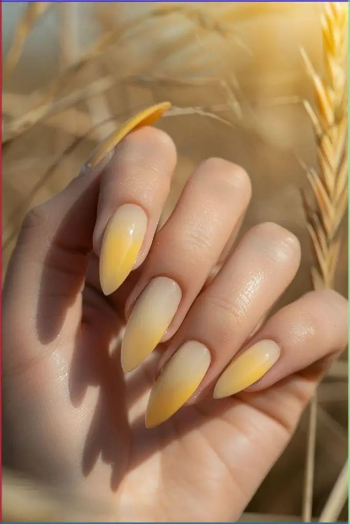 Soft tapered nails with yellow glow.