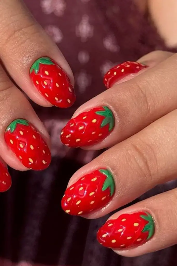 Glossy nails with strawberry designs