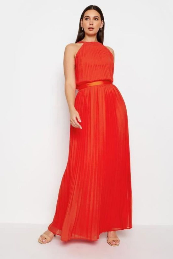 "Tangerine dress with pleated motion."