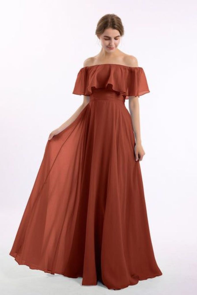 "Terracotta dress with off-shoulder flair."