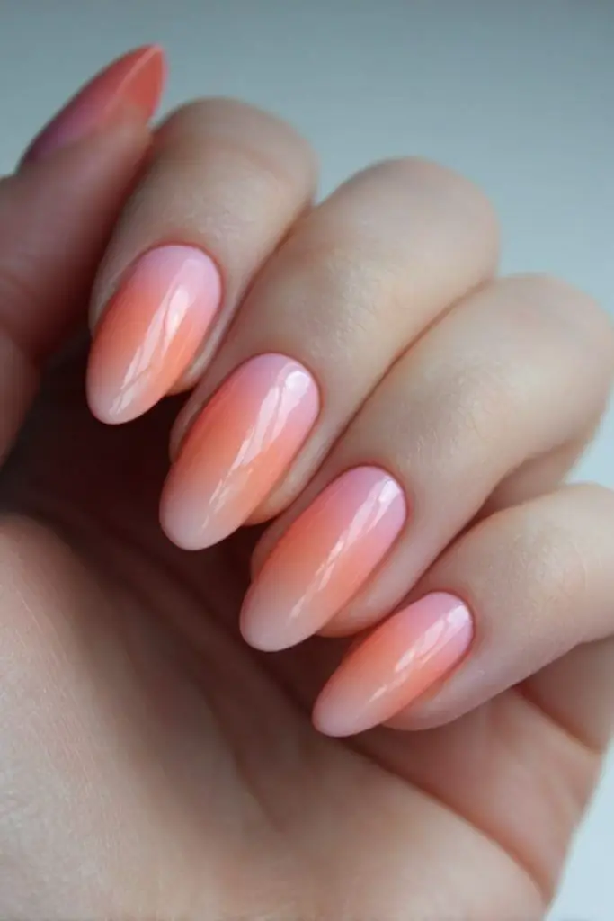 Blush coral nails with glitter dark center
