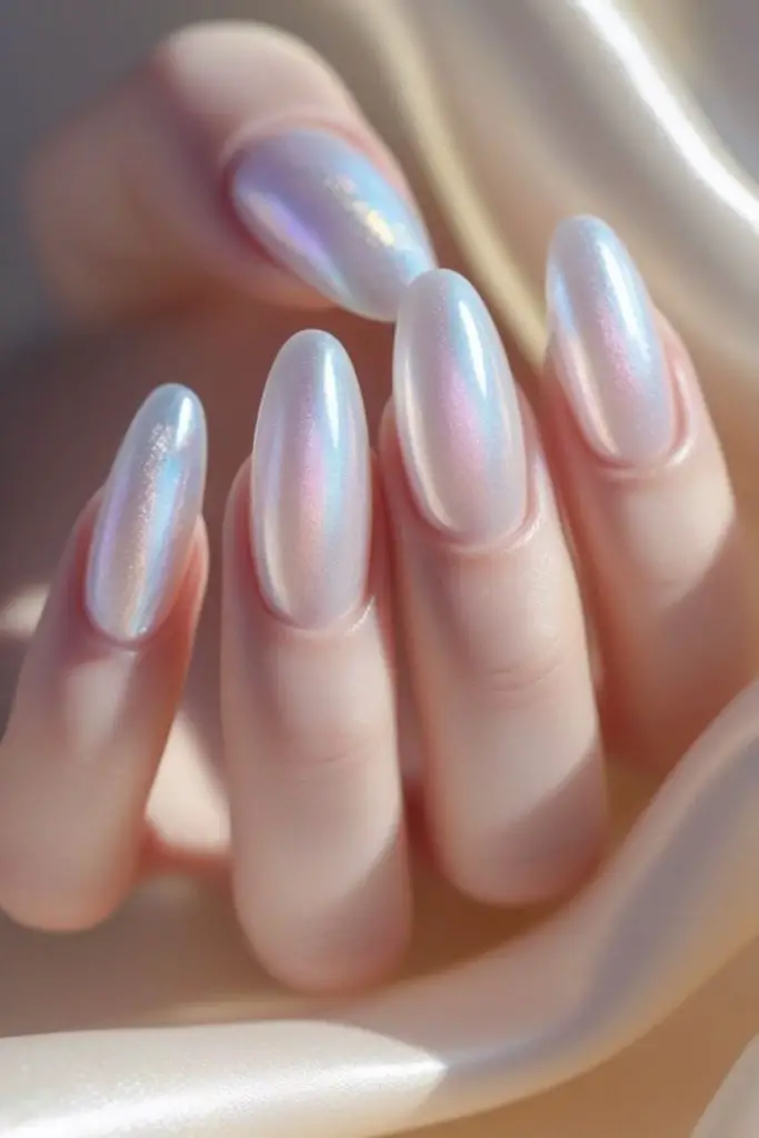 Translucent white nails with cosmic glow.