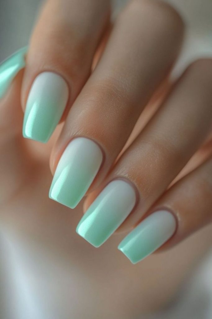 Pastel green nails with soft fade.
