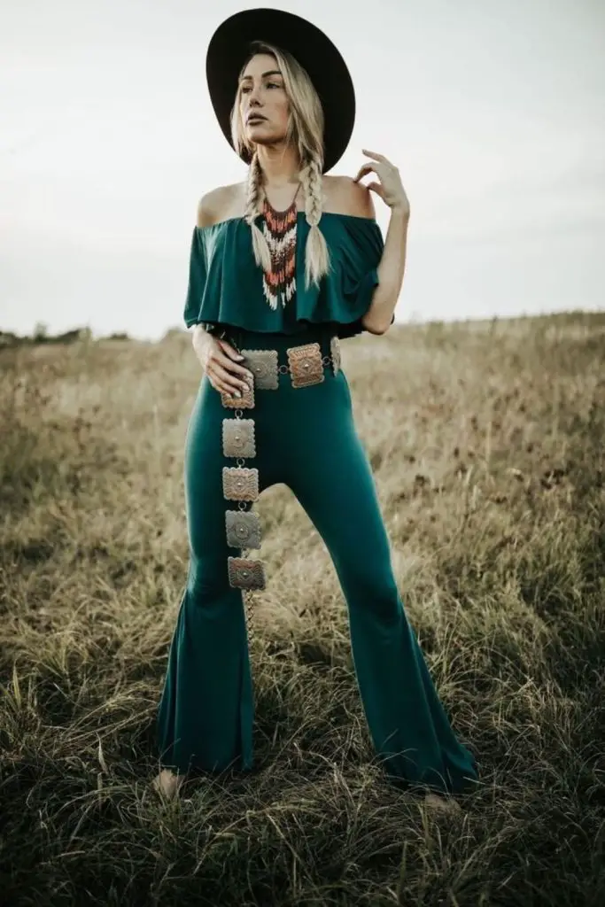 Olive off-shoulder jumpsuit with feather earrings