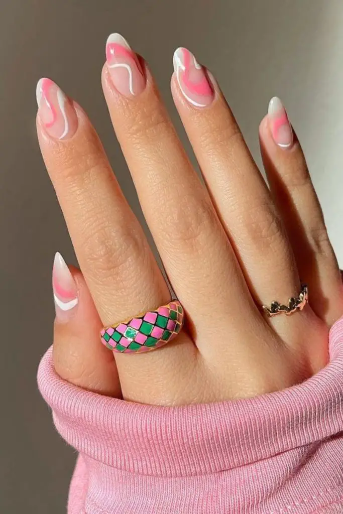 Swirled coral nails with white waves