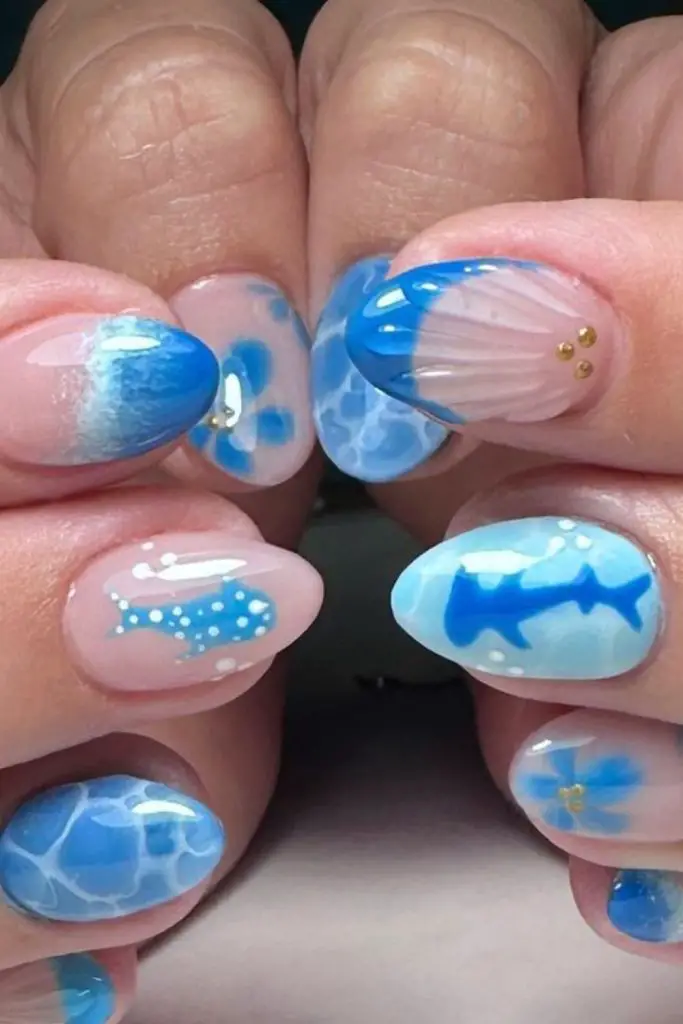 Baby blue nails with dot gradient.