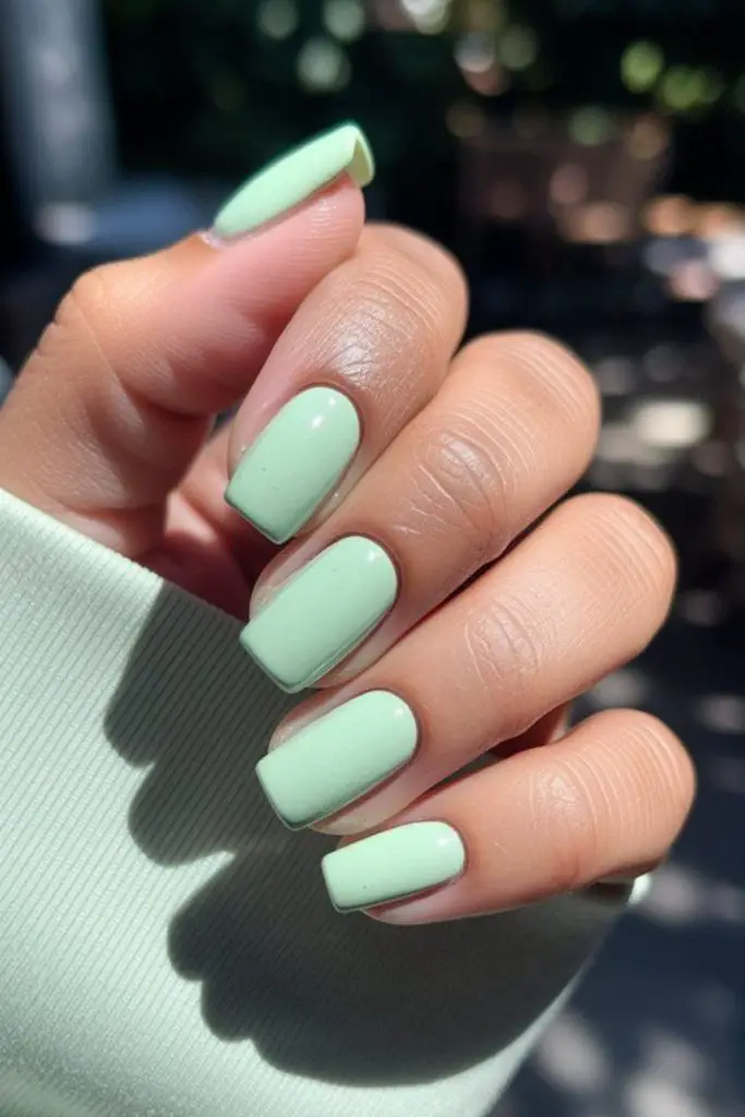 Mint green short nails with shine