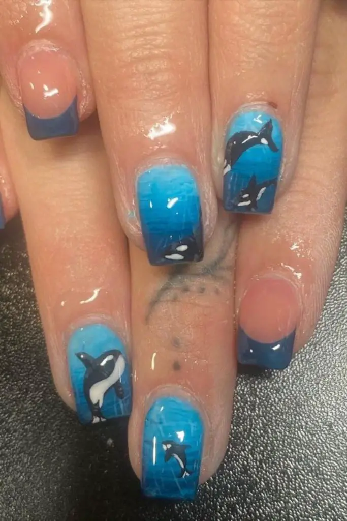 Coral navy nails with random specks.