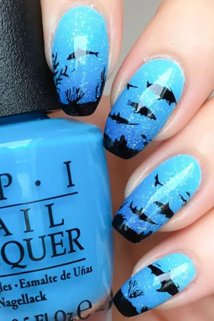 Galaxy-inspired nails with chalk dots.