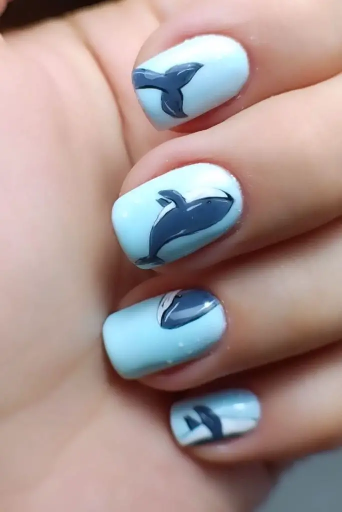 Pastel blue nails with subtle dots.