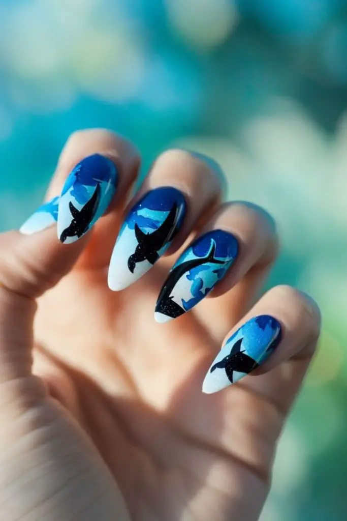 Blue ombre nails with scattered dots.