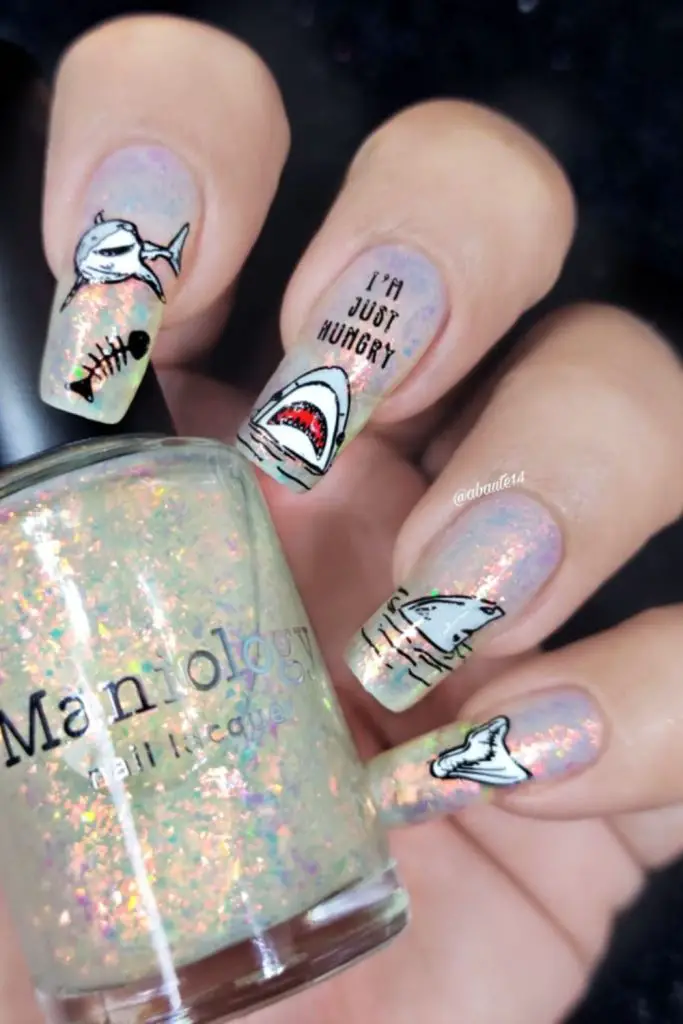 Taupe nails with faded icy freckles.