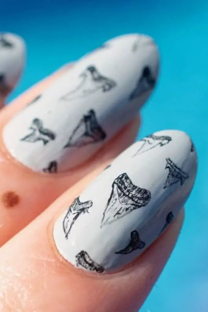 Gray polish with neatly curved dots.