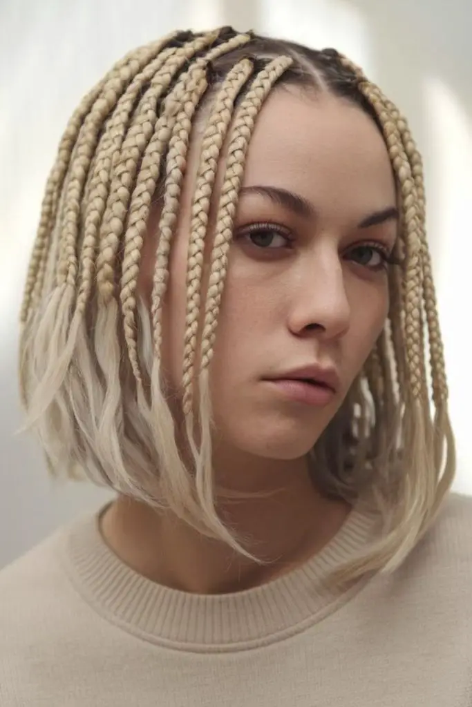 Blonde halo knotless braids with coils