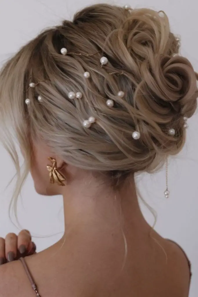 Structured updo accented with pearl pins
