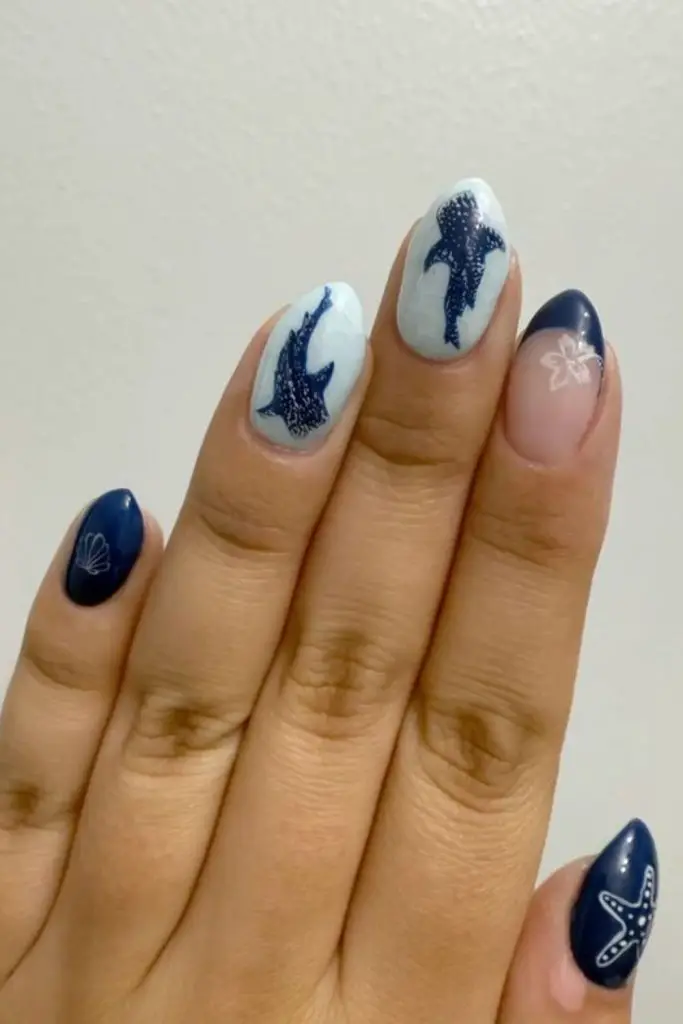 Navy nails glowing with dotted shine