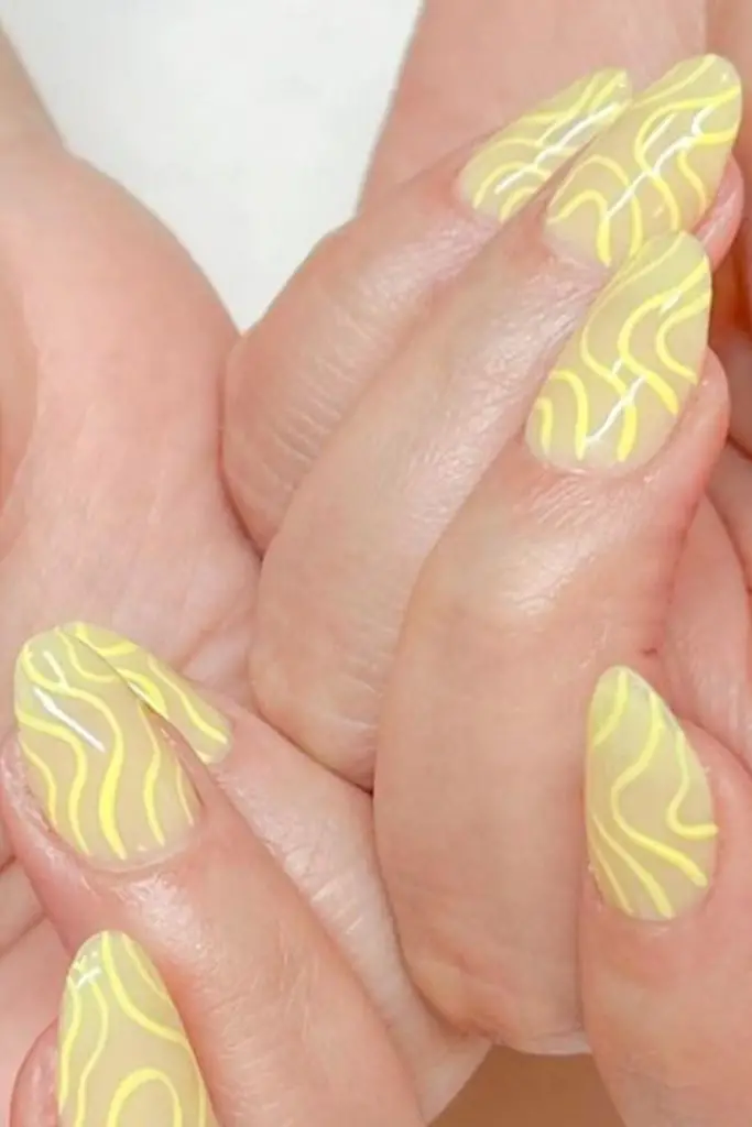Yellow cream swirl nails with gloss
