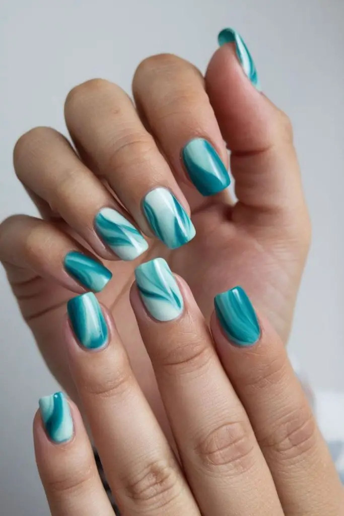Nude polish with turquoise stud accents

