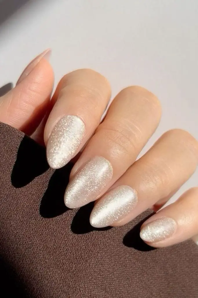 Aurora halo glaze shimmering bridal nails.