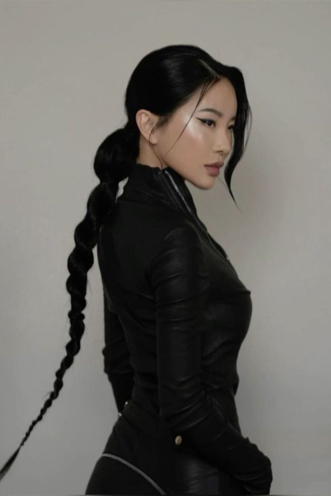 Black widow assassin with sleek ponytail