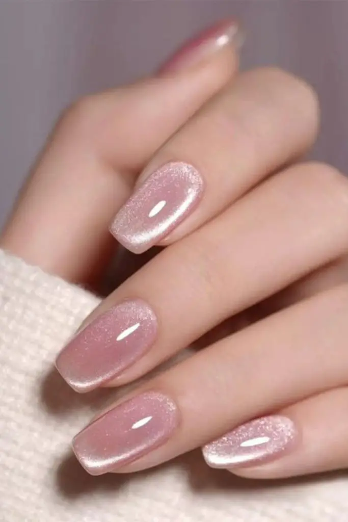 Champagne bubble shimmering nude nails.
